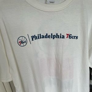All white 76er’s tee